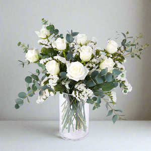 White Roses With Eucalyptus in Vase