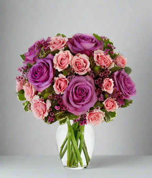 Purple And Pink Roses In Vase