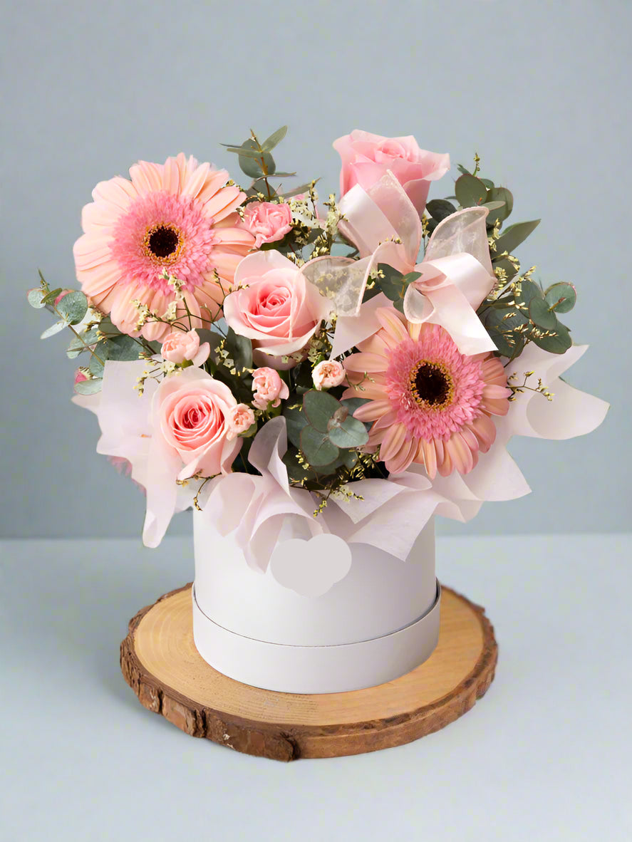 Elegant Pink Flower Box with gerbera, pink roses, pink spray roses, eucalyptus and fillers, arranged in box