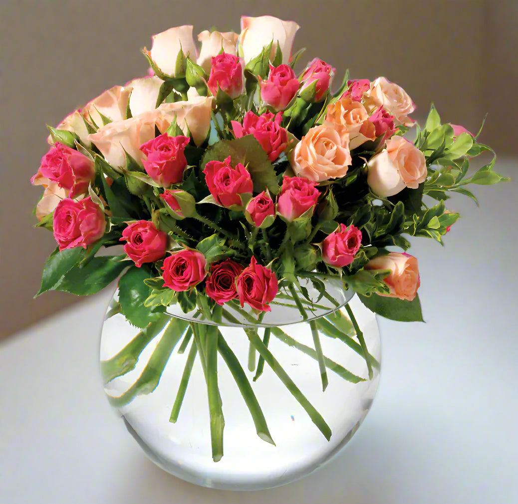 Fuschia and Peach Roses In Glass Bowl